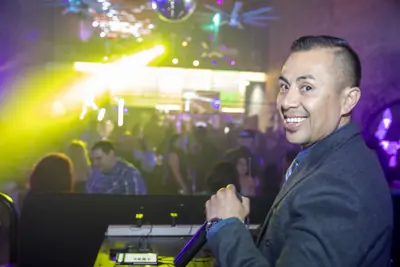 DJ and packed crowd under club lights at Late Nite
