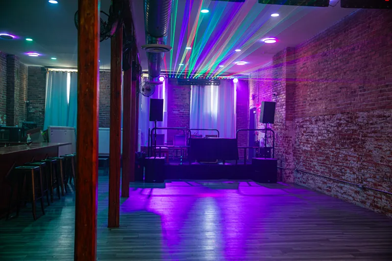 The upstairs room with its own bar, lit for the night