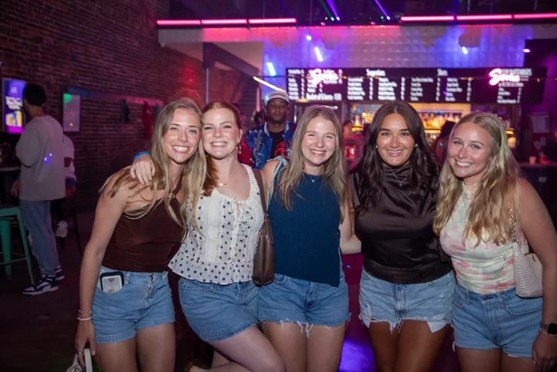 A group of friends together on the floor at Late Nite Macon